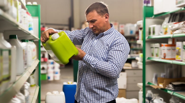 man holding fertilizer