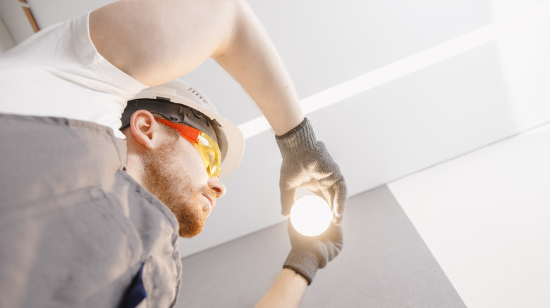 Man installing a bulb