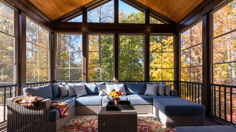 blue sectional in sunroom