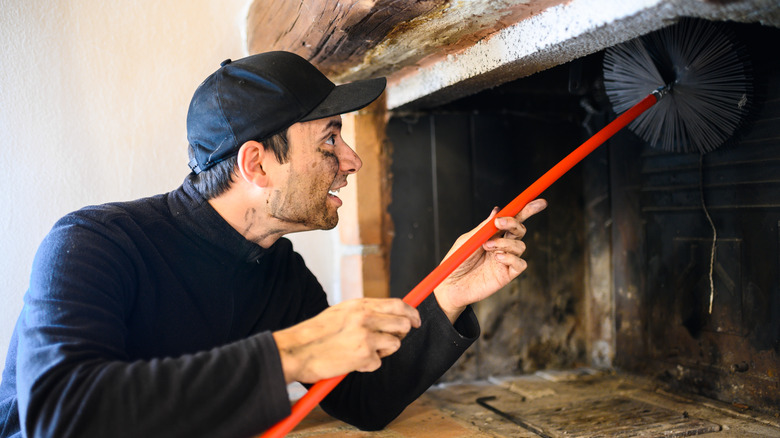 man cleaning chimney