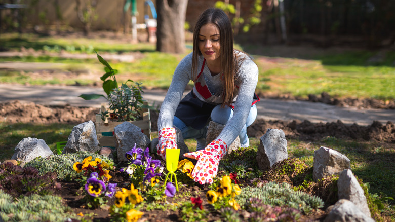 woman planting a flower bed