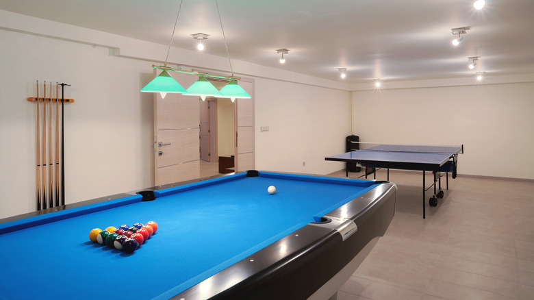 room with blue gaming tables