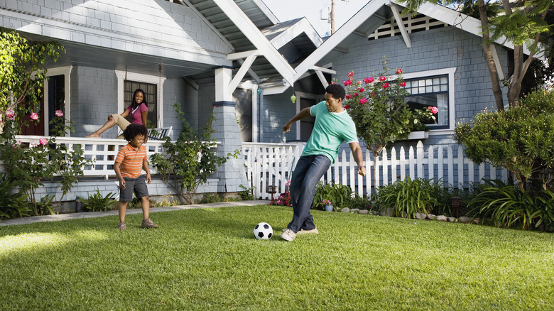 family playing soccer