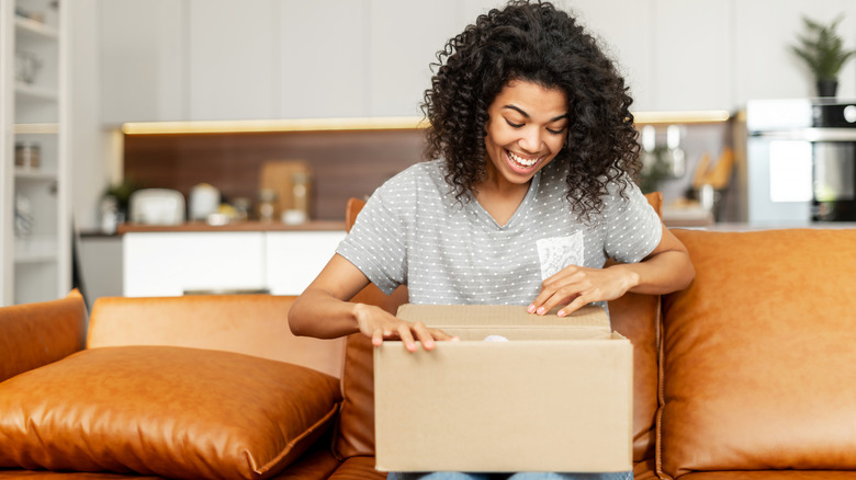 woman boxing items