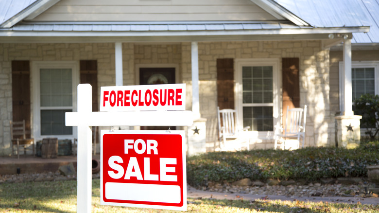 Home with foreclosure sign