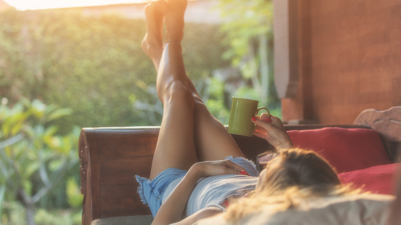 woman in bed on porch