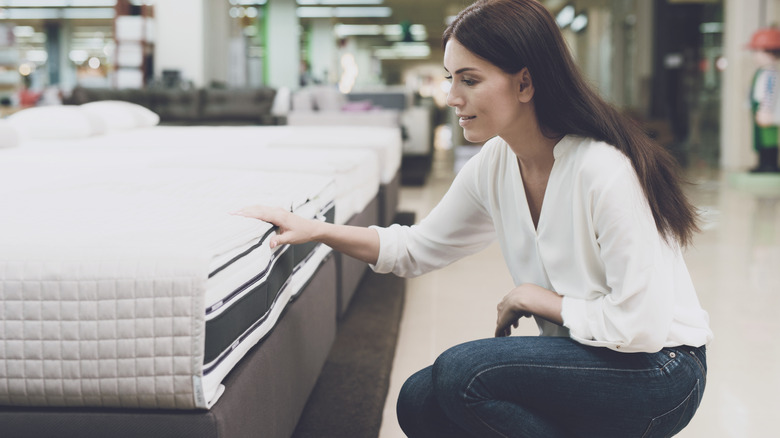 Woman shopping for mattress