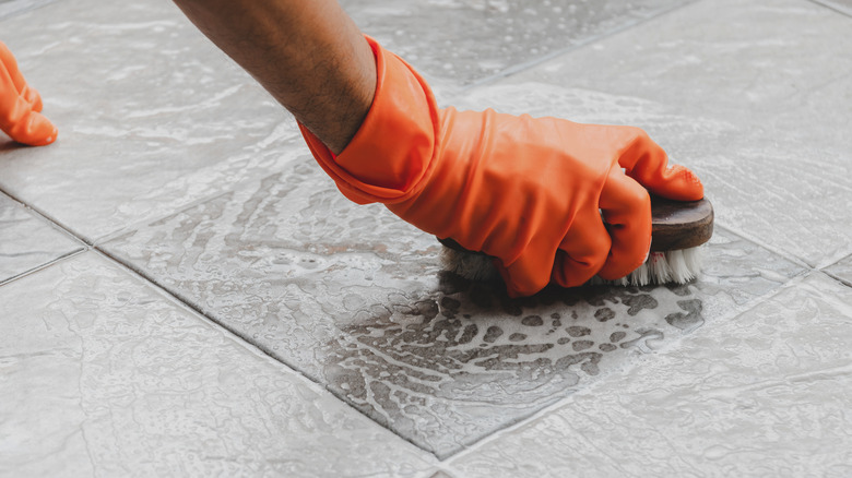 scrubbing shower tiles 