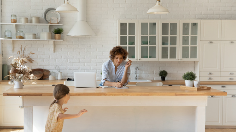 child and woman in kitchen