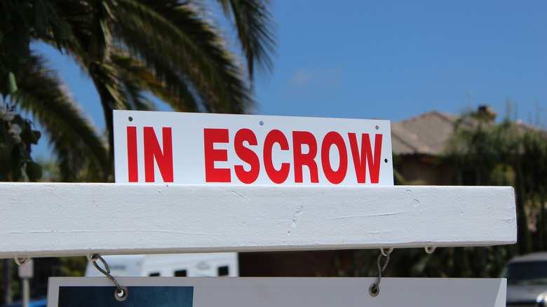 "in escrow" home sign