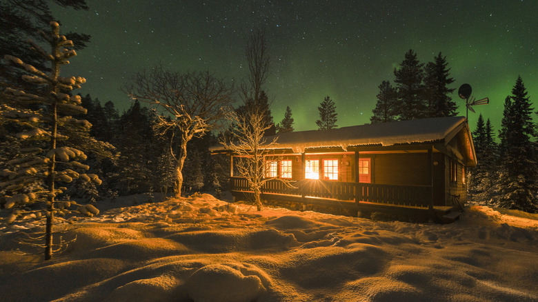 The starry night sky above a cabin