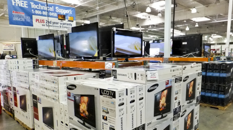 Inside of Costco, focus on televisions