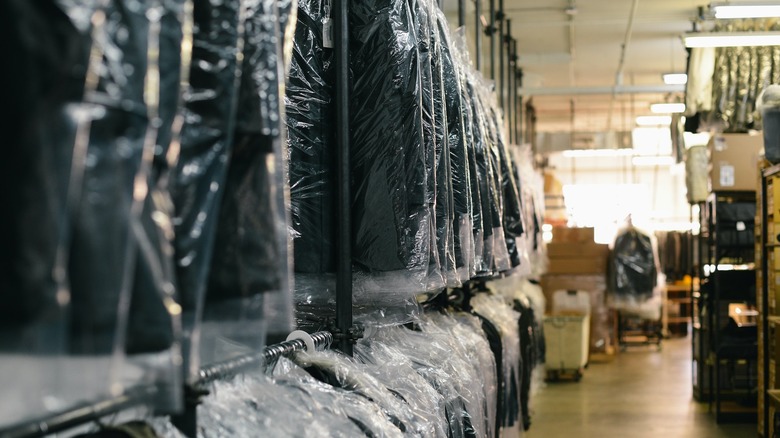 black suits hanged on racks