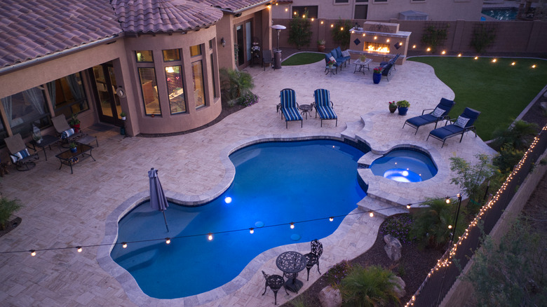 outdoor pool and fireplace