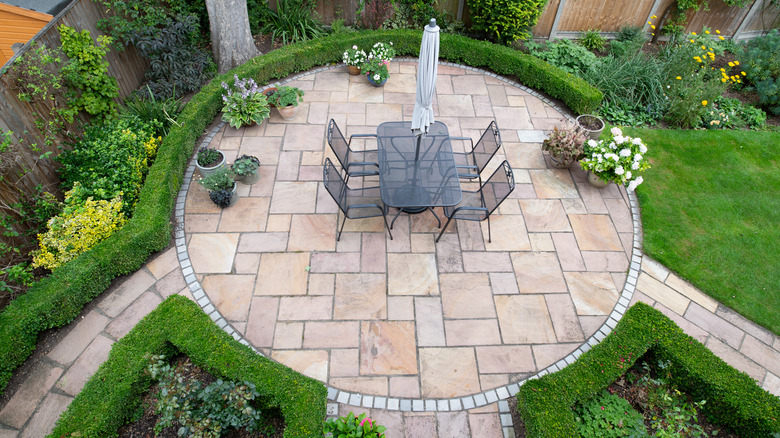 circular stone patio with table 