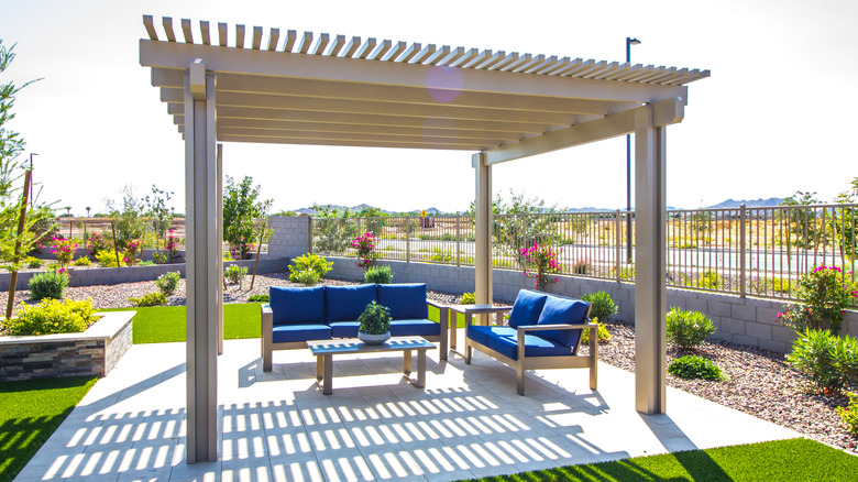 backyard pergola with seating