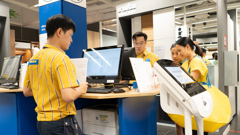 IKEA employees by computers