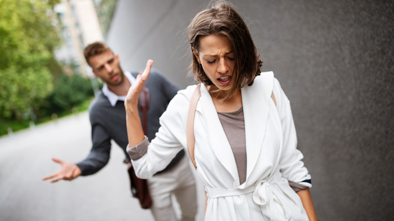 angry couple fighting outside