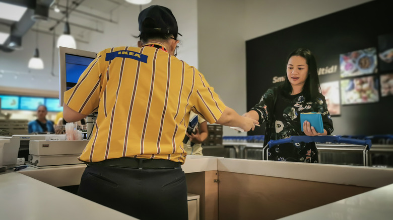 Ikea employee interacting with customer