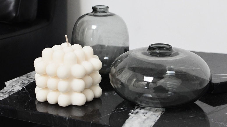 Smoked glass containers on table