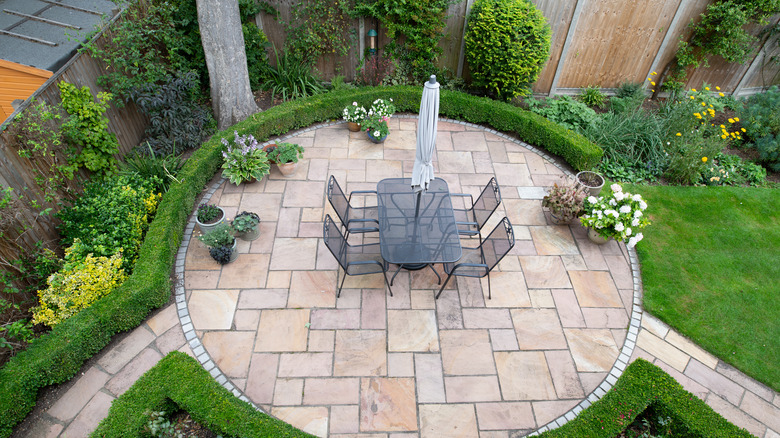 Stone patio with a table and chairs