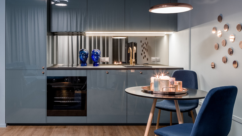 Modern kitchen with blue chairs