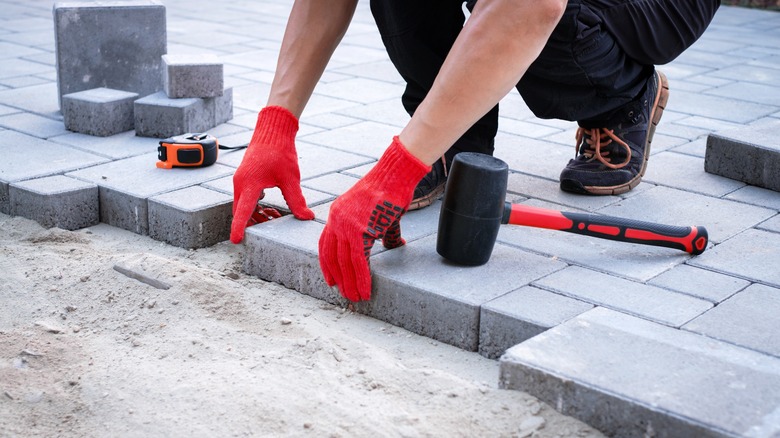 laying new brick pavers