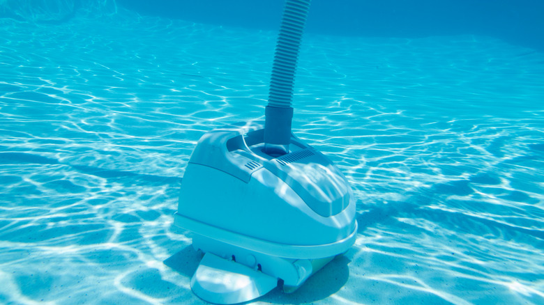 Vacuum cleaner in swimming pool