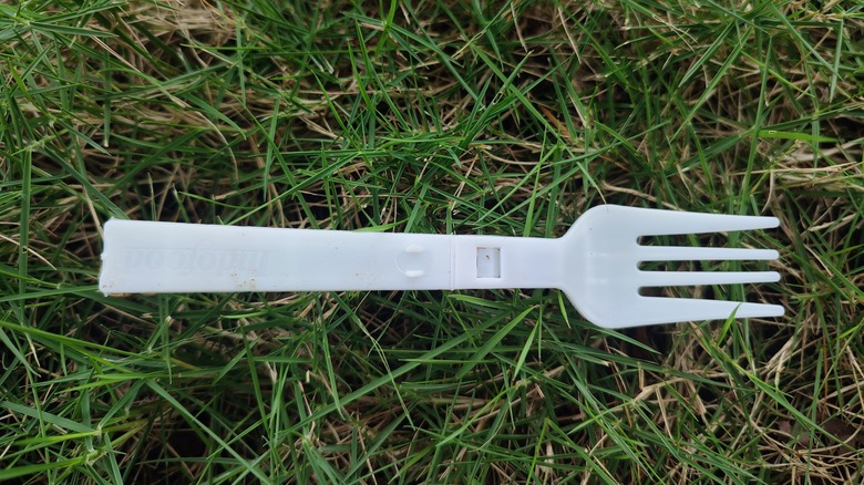 plastic fork on grass