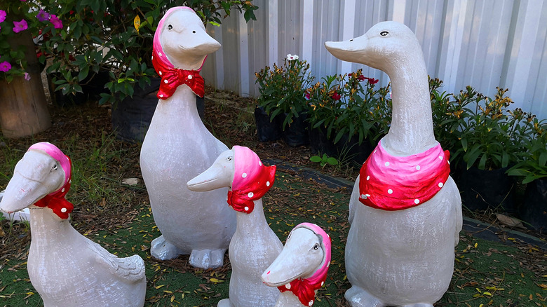 Decorative garden geese in pink scarves