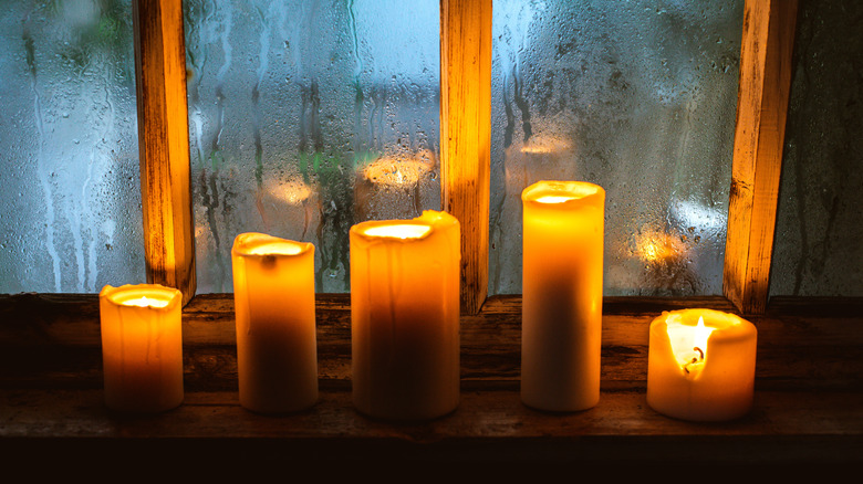 Candles burning in window