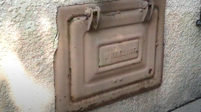 coal chute door on exterior of home