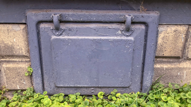 gray painted coal chute door