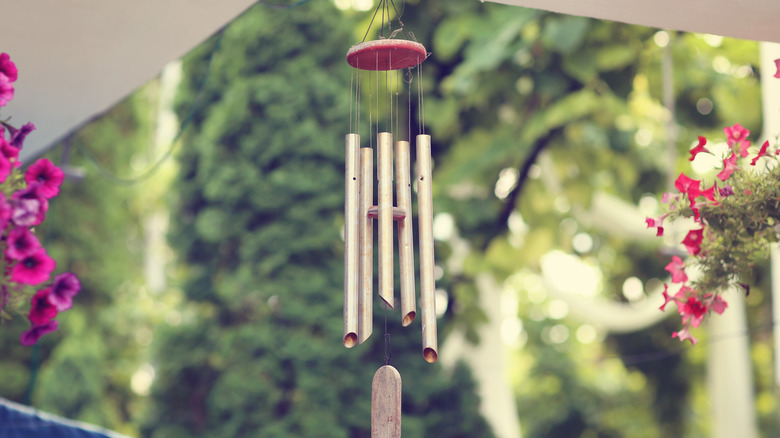 Wind chimes hanging on porch