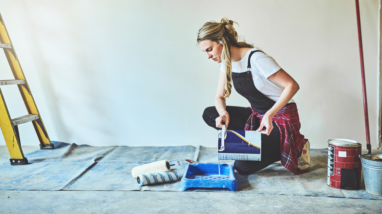 woman preparing to paint wall