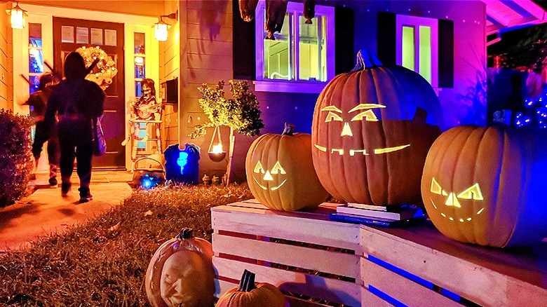 Trick-or-treaters visiting house on Halloween