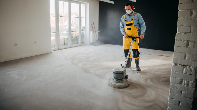 Man working on burnished concrete floor