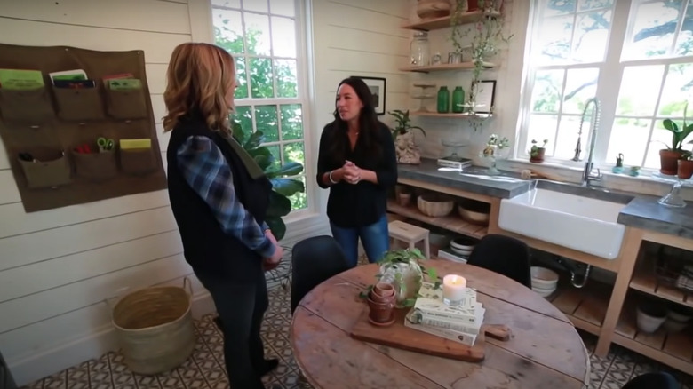 Joanna Gaines in her kitchen with a friend