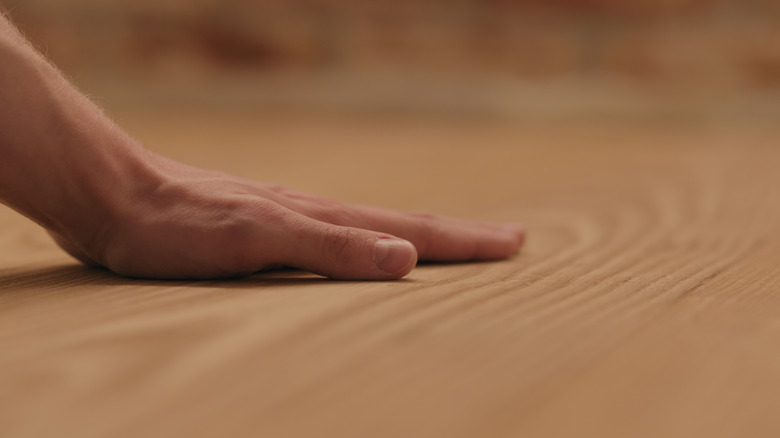 examining wood floors 