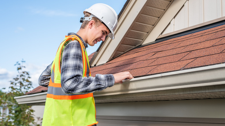 Home inspector checking roof