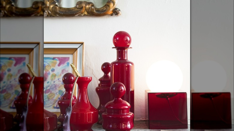 Grouping of red glass bottles