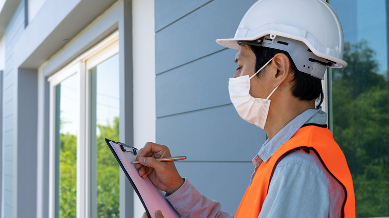 Home inspector with clipboard 