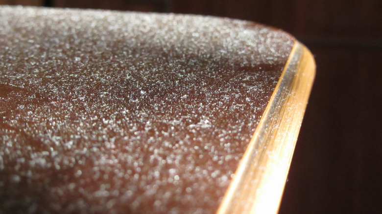 White dust on wooden table