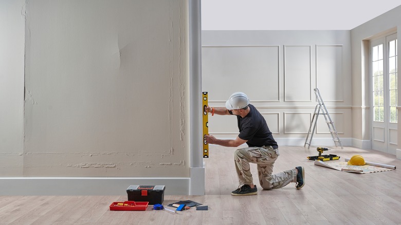 Man repairing home interior