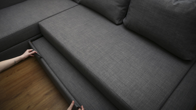 Gray sectional with pull out sleeper