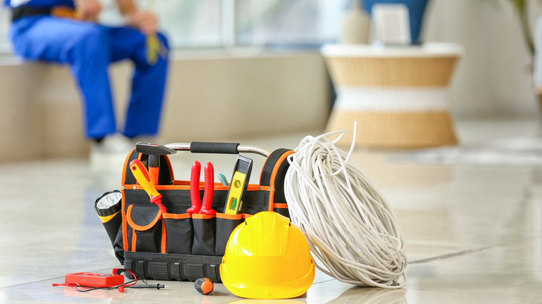 Electrician with tools in foreground