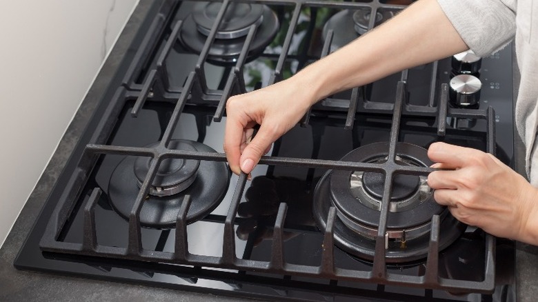 Removing burners from stove