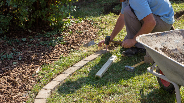 making a stone paver lawn edging