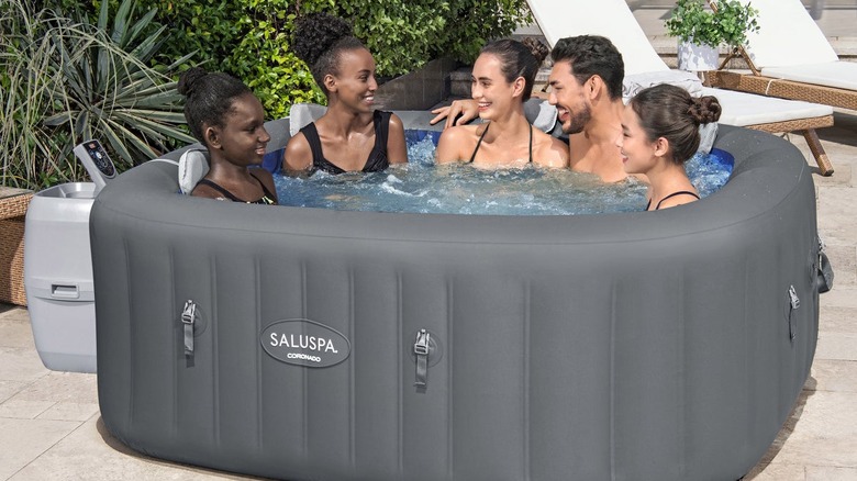 SaluSpa Coronado hot tub with 5 adults in it