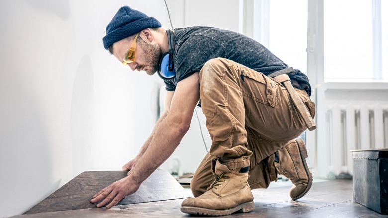 Man installing hardwood flooring 